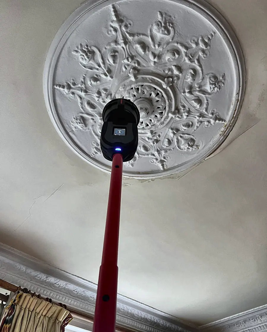A second detector set in an ornate plaster ceiling rose, tested in place